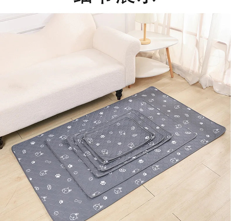 Gray pet pee pads are laid out on a light wooden floor in front of a white sofa.