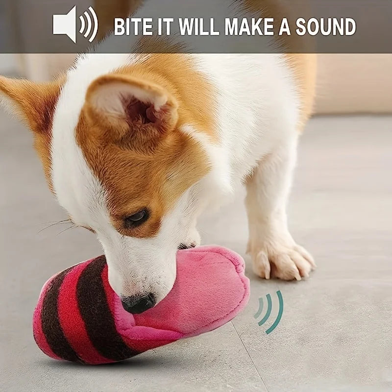 A brown and white dog is licking a pink striped plush toy designed to make a sound.