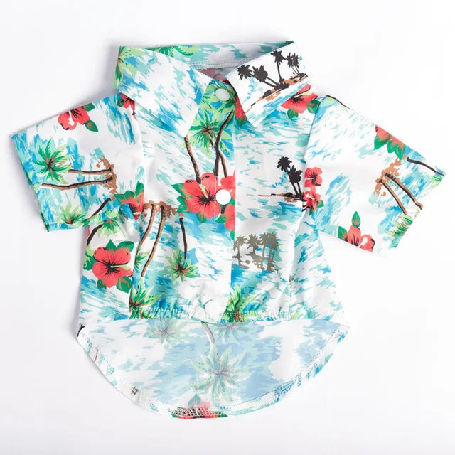 A short-sleeved shirt featuring a Hawaiian leaf print design with tropical flowers and foliage.