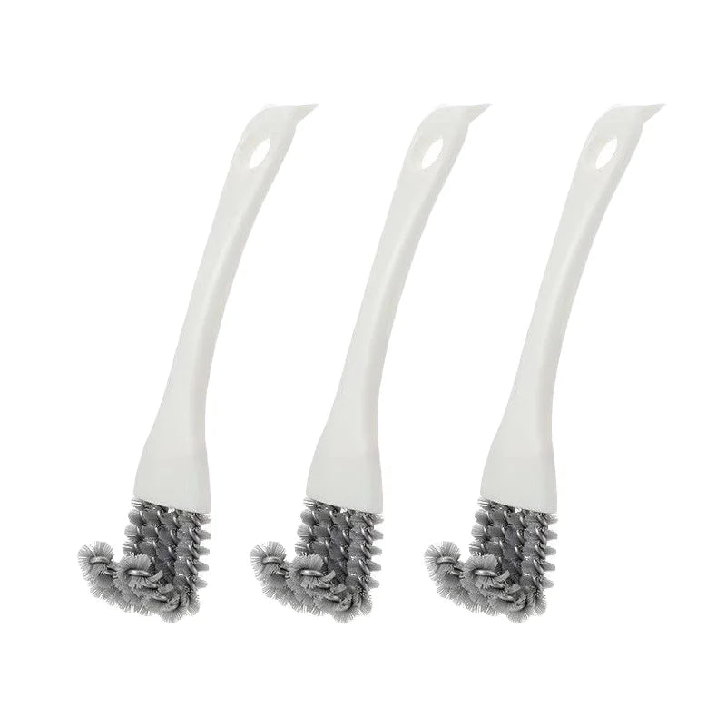 Trois brosses de nettoyage pour cage d'animal en silicone blanc avec poils gris