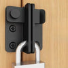 A black sliding bolt lock mounted on a wooden surface, featuring a silver-colored hasp.