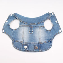 A light blue denim dog jacket with a D-ring leash attachment.
