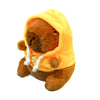 A fluffy brown capybara plush doll wearing a bright yellow hoodie.