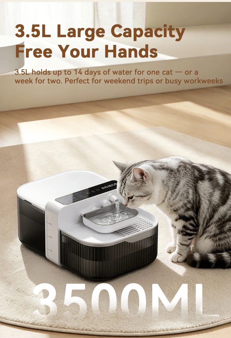 A gray tabby cat is drinking water from a white pet water fountain device on a light-colored rug.