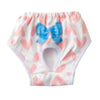 White reusable dog physiological pants with pink heart patterns and a blue bow.