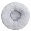 A round, light gray ultra-soft plush pet bed for dogs and cats.