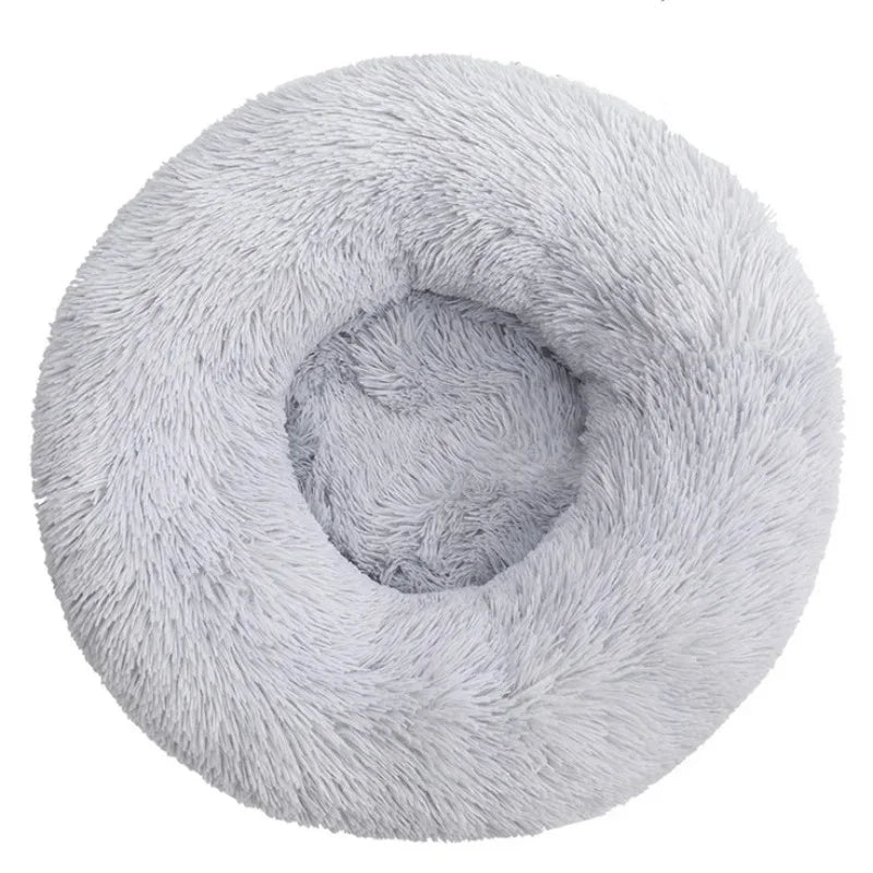 A round, light gray ultra-soft plush pet bed for dogs and cats.