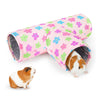 A pink floral fabric pet tunnel with a gray lining and a small guinea pig is visible.