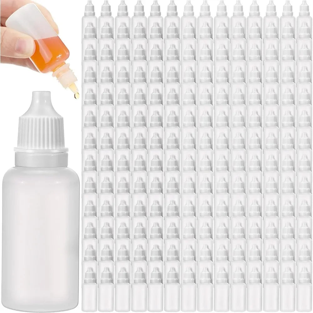 A white dropper bottle with a pipette and numerous small glass droppers arranged in a grid.