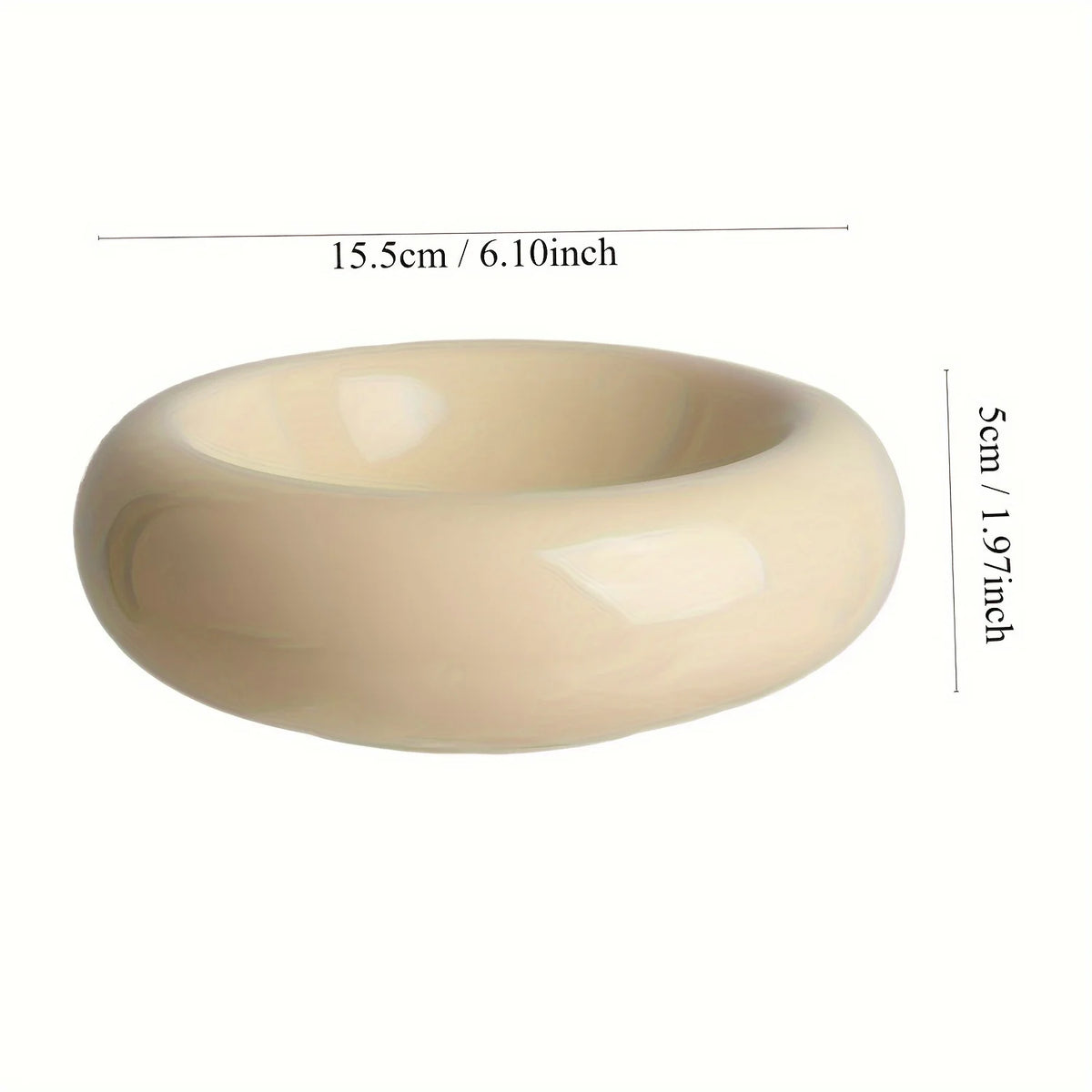 A smooth, beige ceramic donut cat bowl with a wide rim and a slight concave shape.