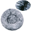 A plush round pet bed with a gray, fluffy cover and a circular inset showing close-up fur texture.