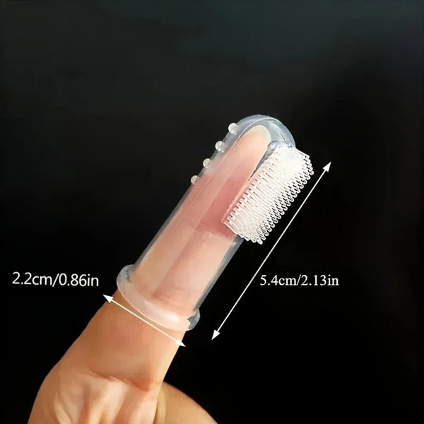 A hand holds a soft silicone finger toothbrush for pets, showing the brush and its dimensions.