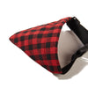A red and black plaid bandana scarf for dogs and cats, shown with a black adjustable strap.