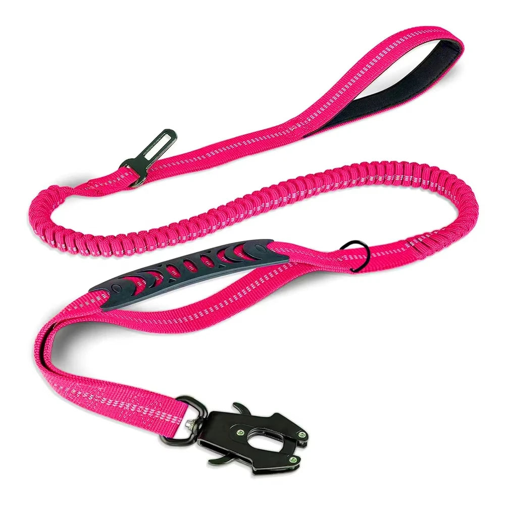 A bright pink reflective bungee dog leash with a black car seatbelt clip.