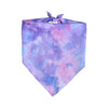 A purple and pink tie-dye fabric bandana or neck scarf with a tie at the top.