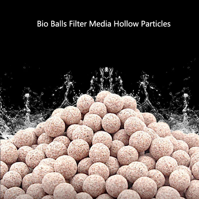 A close-up view of light pink bio balls filter media particles piled up, showing a porous texture.
