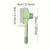 A light green stainless steel pet hair remover brush with a comb attachment.
