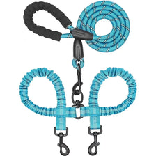 A dual dog leash with shock absorbing bungee for two dogs, featuring blue and black cord handles.