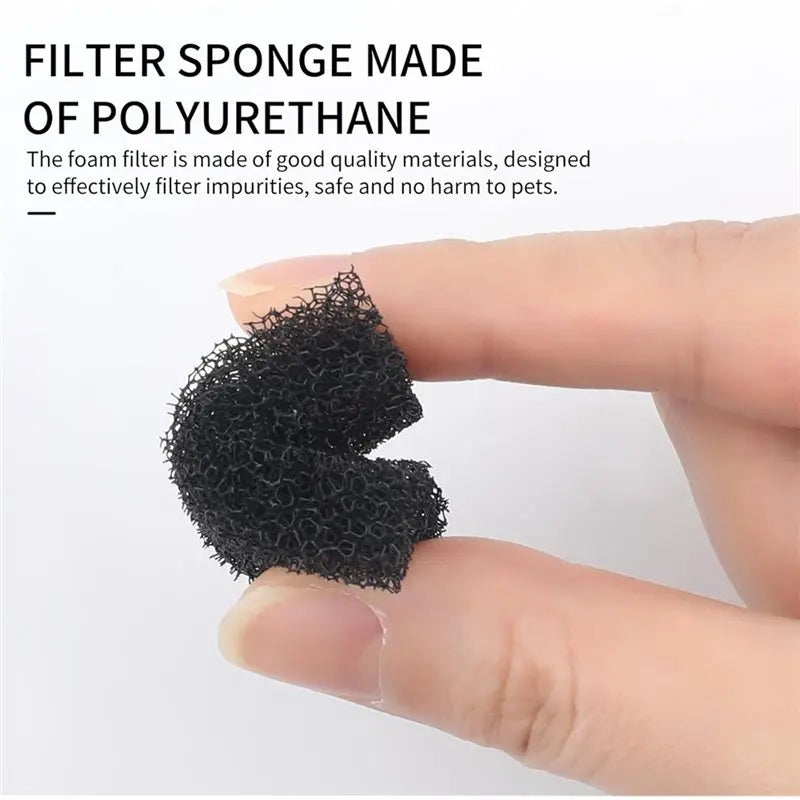 A hand holds a black sponge filter made of polyurethane, designed to filter impurities for pets.