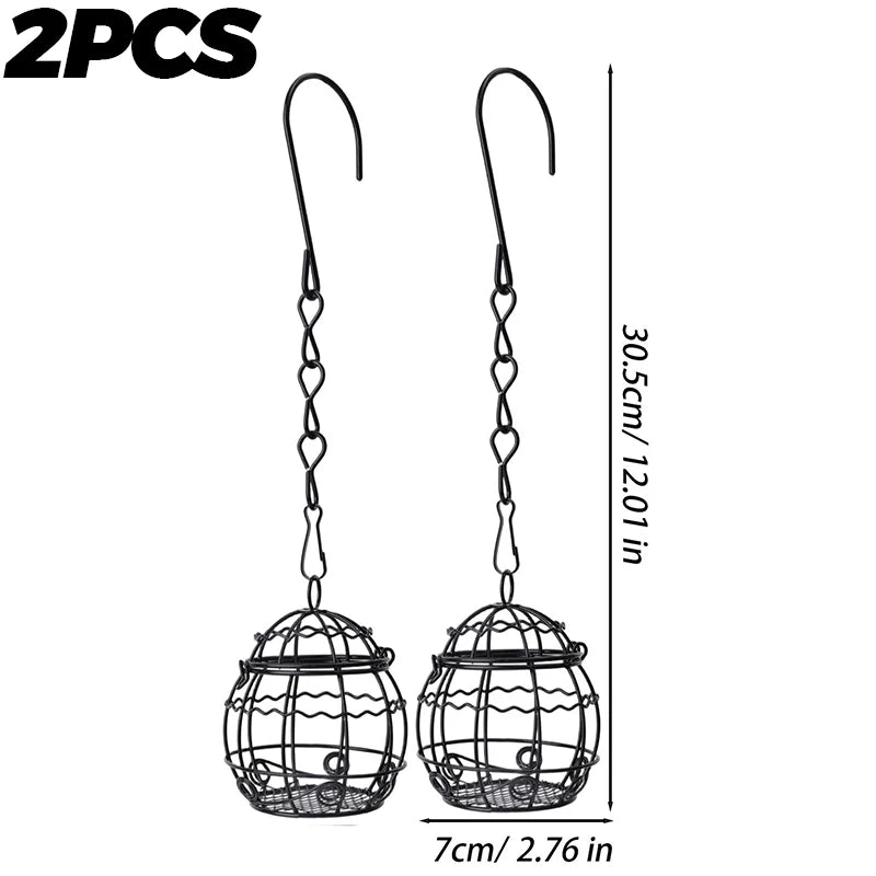 Two decorative hanging metal bird feeders with wire cages and hooks.