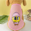 A brown stuffed animal wearing a pink breathable mesh vest with a yellow and pink girl cartoon print.