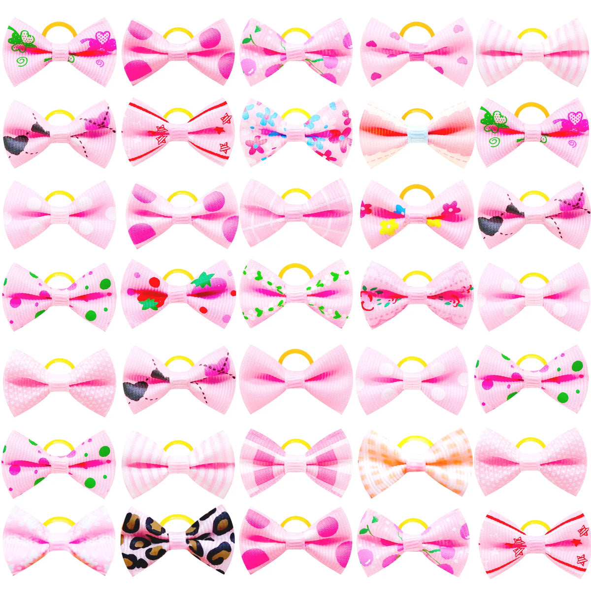 A collection of pink and multicolored pet hair bows with gentle rubber bands.