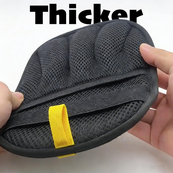 A hand holds a black reusable pet hair removal glove with a yellow accent on the palm.