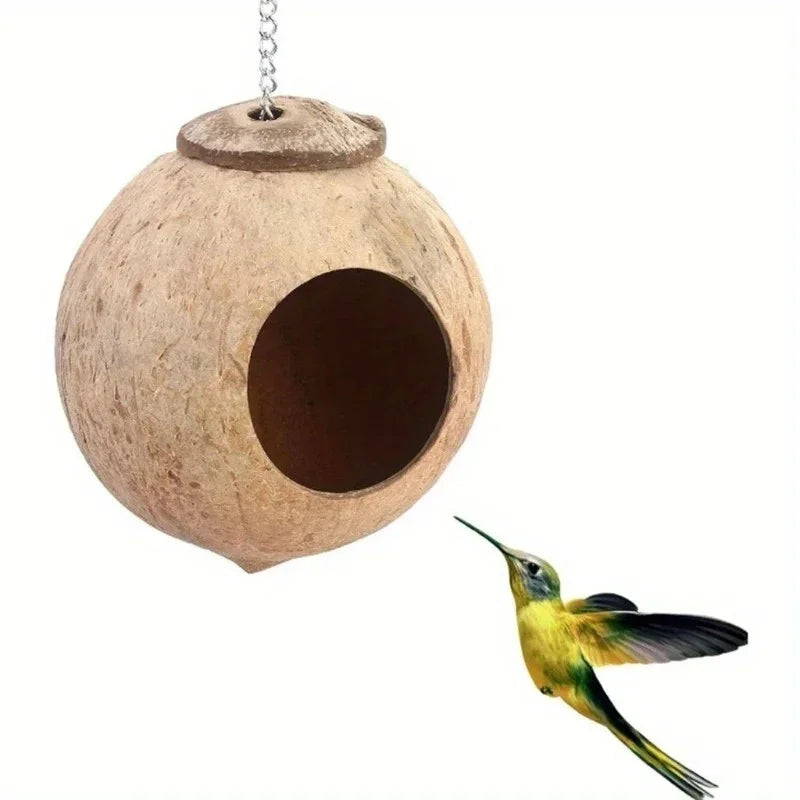 A natural coconut shell bird nest house hanging from a silver lanyard.