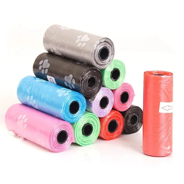 Rolls of disposable dog waste bags in various colors including pink, blue, green, and orange.