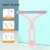A pink silicone double-sided pet hair and lint remover with adjustable angles shown next to a light blue background.