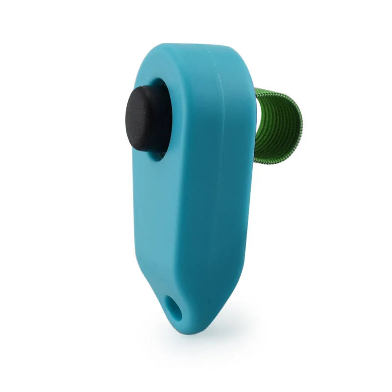 A teal plastic pet training clicker with a black button and a green textured grip.