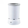 A white automatic pet paw cleaner cup with a cylindrical design and a charging port visible on the base.