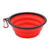 A bright red silicone pet feeder bowl with a black rim and a carabiner attached.