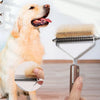 A golden retriever dog standing next to a double-sided grooming comb and brush set.
