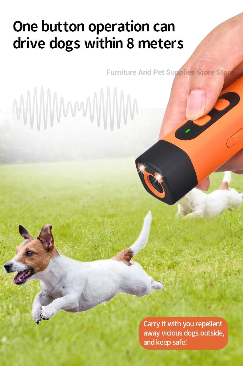 A hand holds an orange ultrasonic dog bark deterrent device, with a white dog running nearby on green grass.
