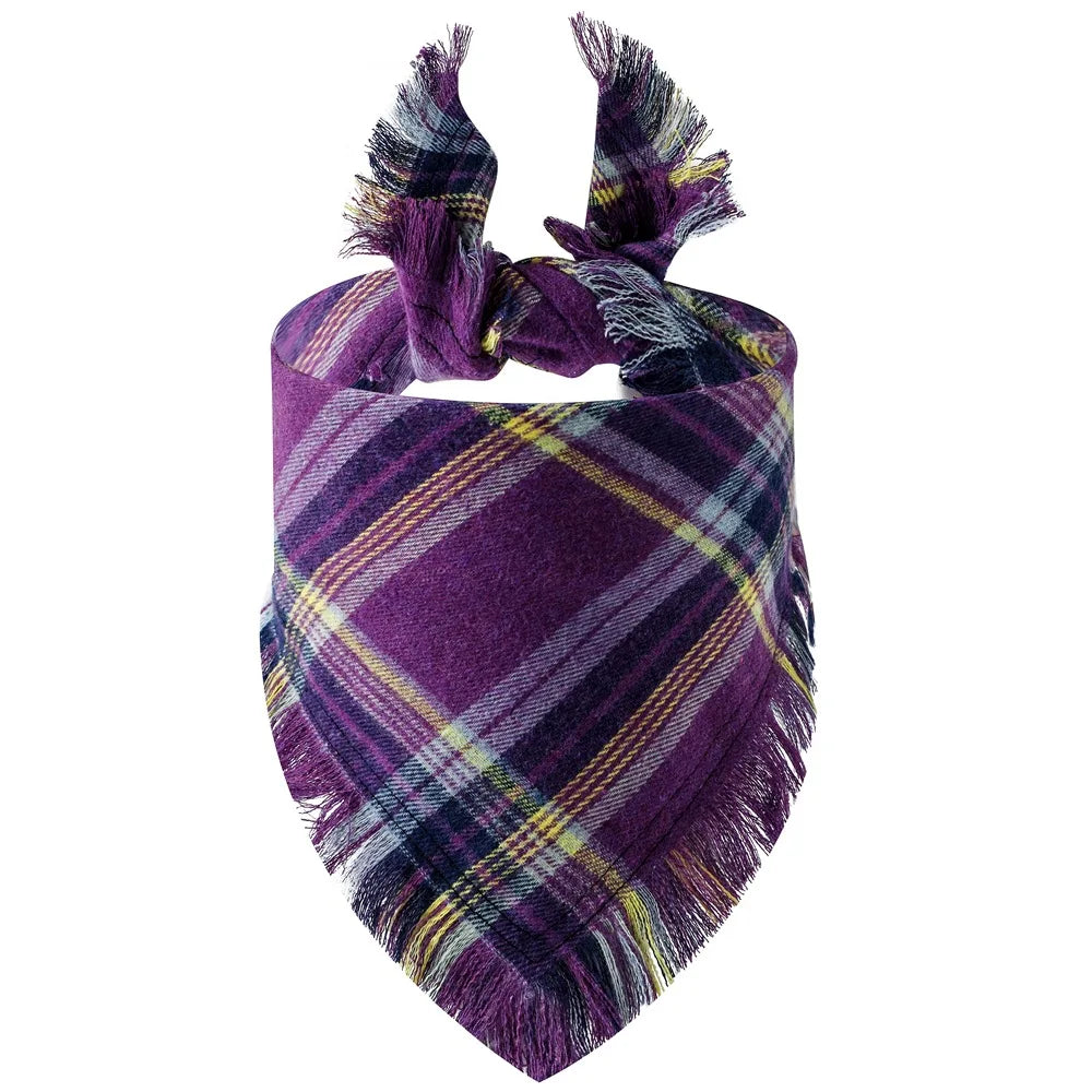 A purple and yellow plaid dog bandana with fringed edges.