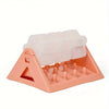 A pink interactive dog food puzzle dispenser with silicone feeding tubes and a triangular base.