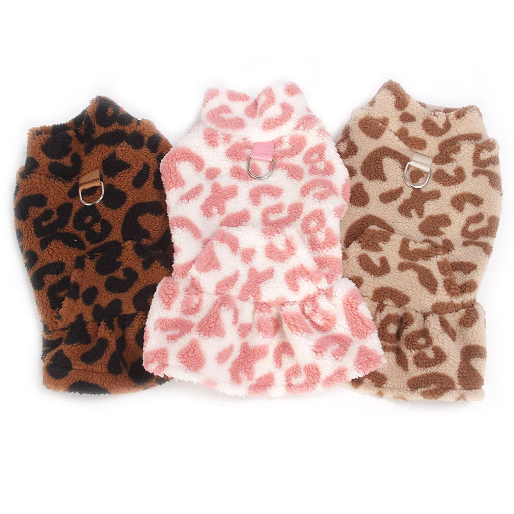 Three leopard print dog princess dresses in brown, pink, and tan colors