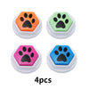 Four colorful recordable talking buttons for dog training featuring paw print designs.