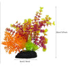 Un arrangement vibrant de plantes décoratives aquatiques artificielles aux feuillages orange, jaune et violet.