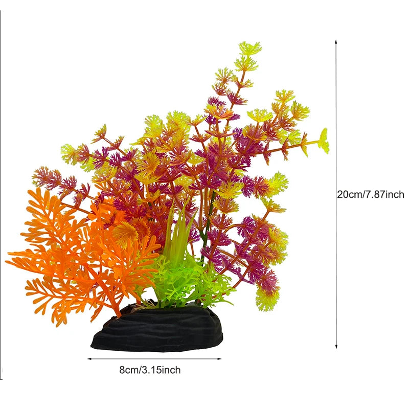 Un arrangement vibrant de plantes décoratives aquatiques artificielles aux feuillages orange, jaune et violet.