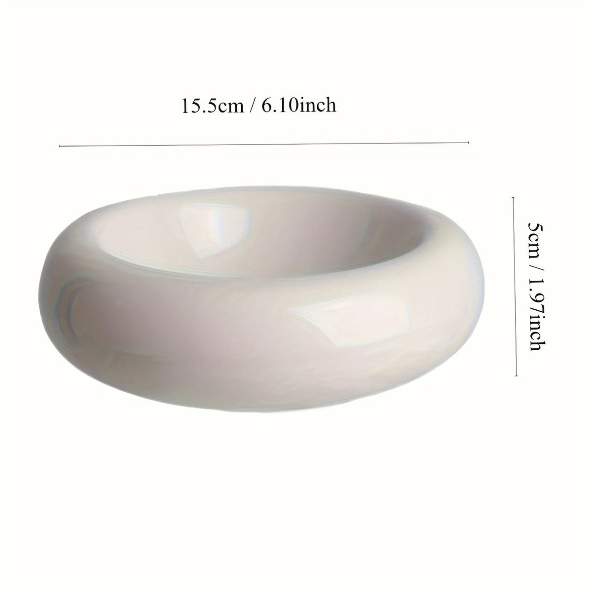 A white ceramic donut cat bowl with a smooth, rounded shape and a slight lip.