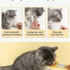 A tabby cat is using a long-handled pet food dispensing spoon to eat food.