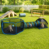 A green outdoor scene showing a black pet playpen and an open black play tent on a lawn.