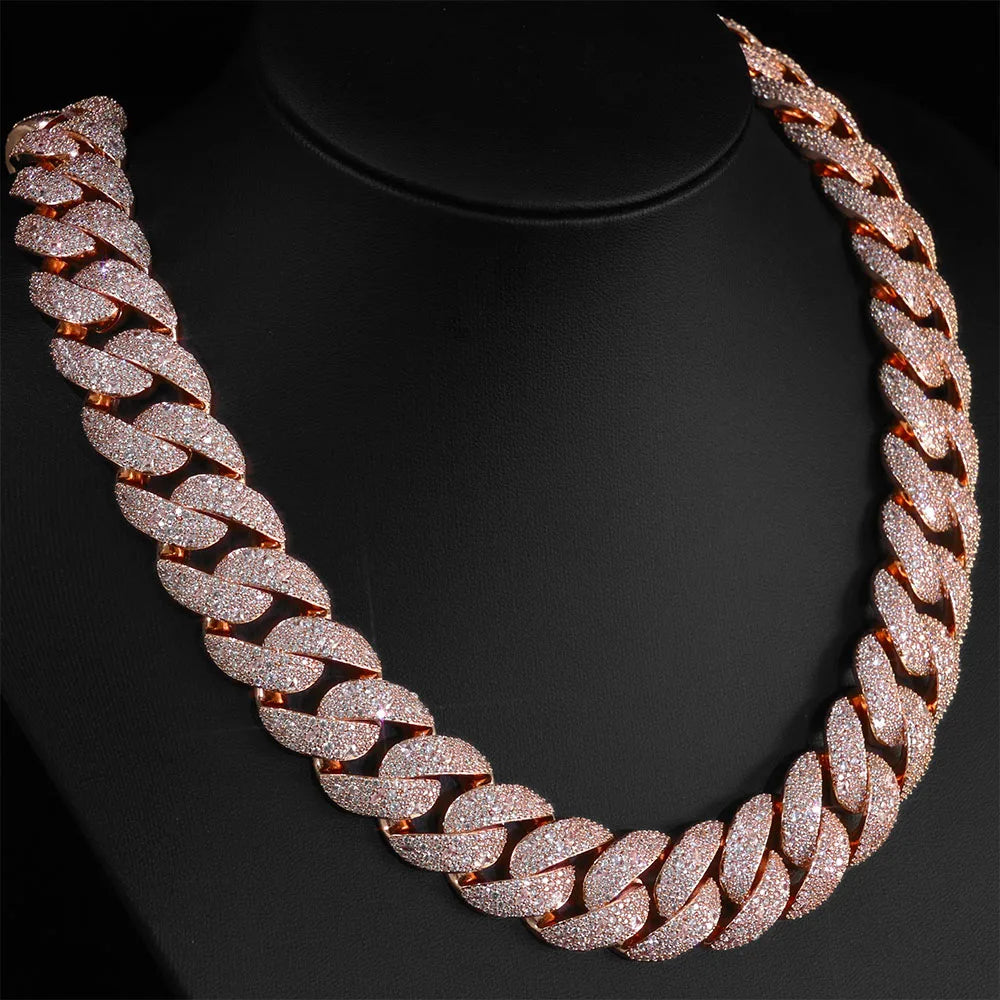 Rose gold plated curved flip buckle Cuban link necklace displayed on a black display stand.