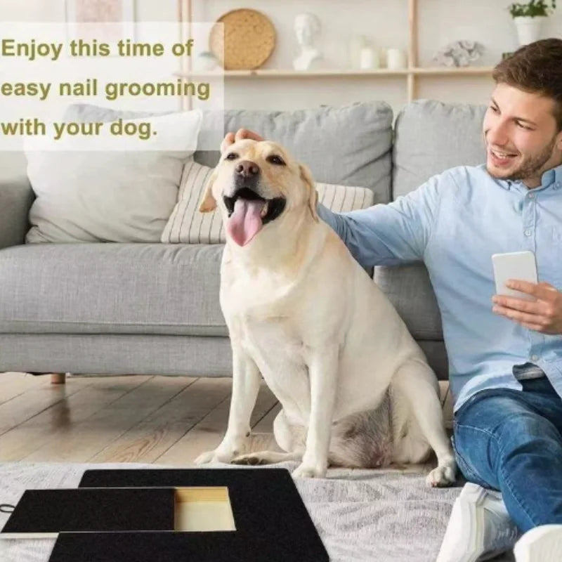 A man is enjoying nail grooming with his dog on a couch, with a wooden pet scratching board visible in the foreground.