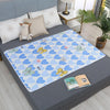 A blue patterned waterproof cartoon bed protector pad featuring heart shapes and butterfly designs.