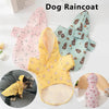 A yellow dog raincoat with pink floral patterns is displayed next to a light blue one.