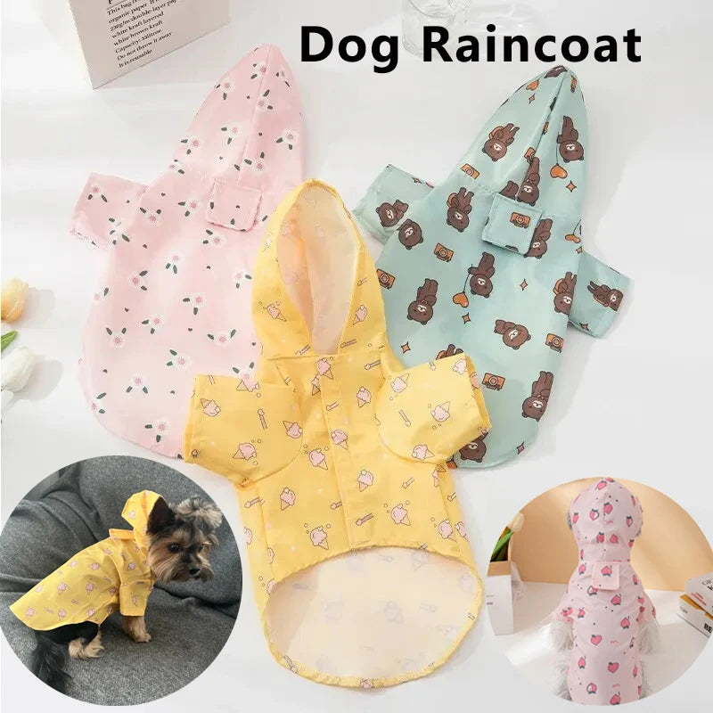 A yellow dog raincoat with pink floral patterns is displayed next to a light blue one.