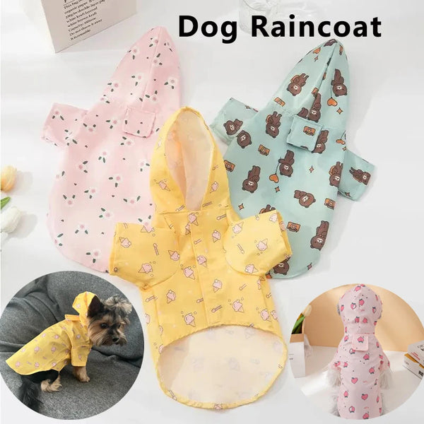 A yellow dog raincoat with pink floral patterns is displayed next to a light blue one.